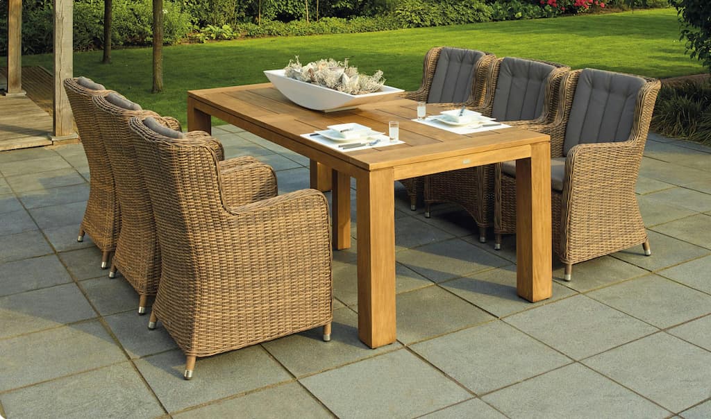 table and chairs on a natural stone paving area